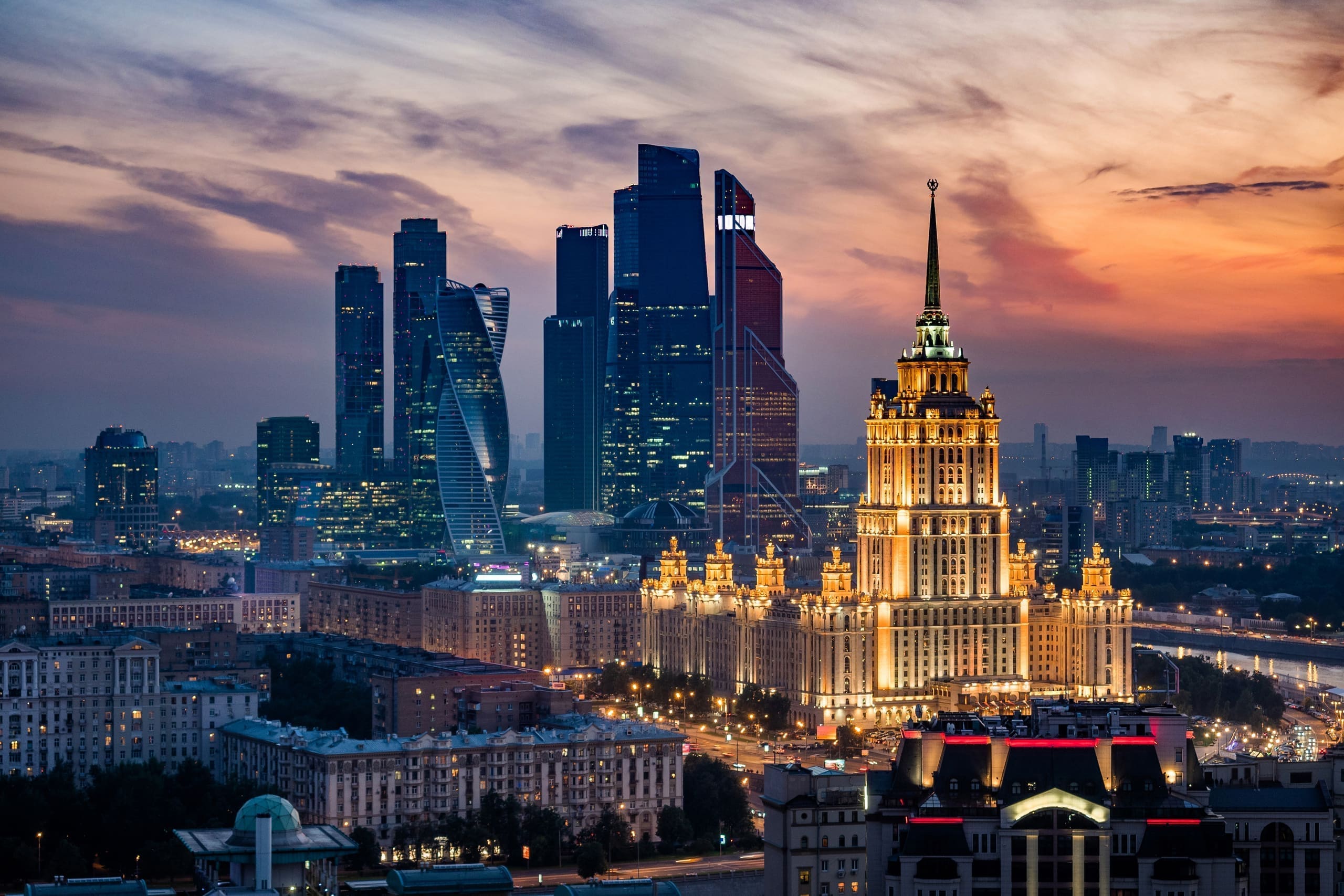 Aerial view of a city skyline at dusk