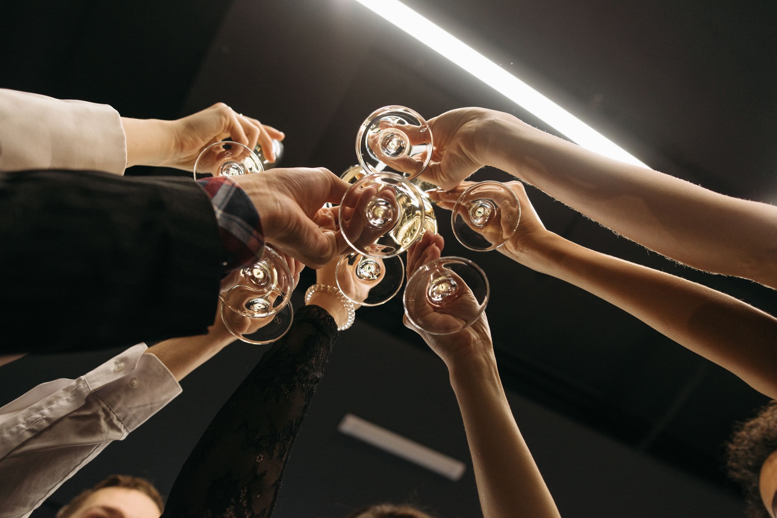 Speaker raising a champagne toast at a corporate grand opening